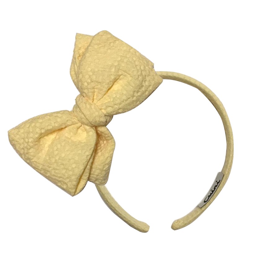 Diadema lazo relieve amarillo Cuini