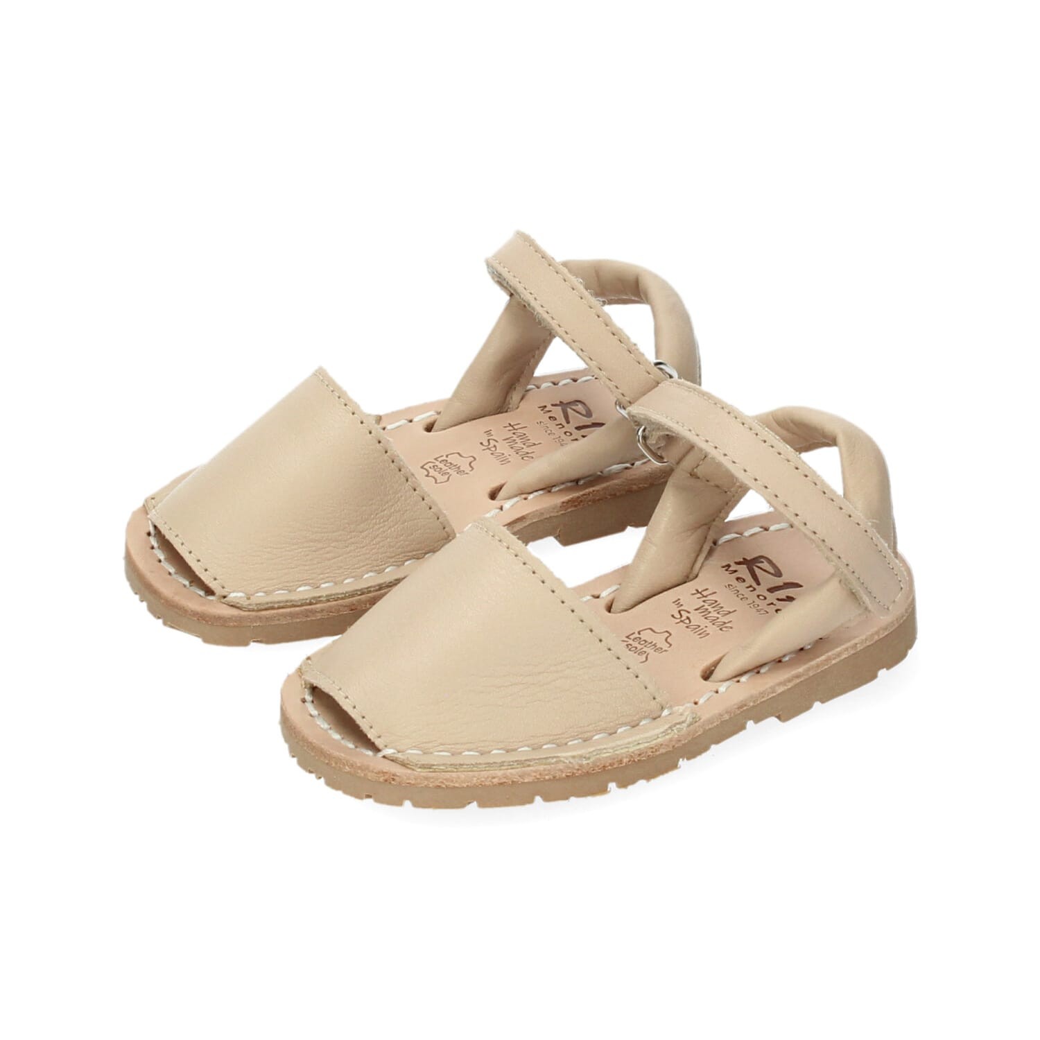 Sandalia en piel beige con velcro. RIA